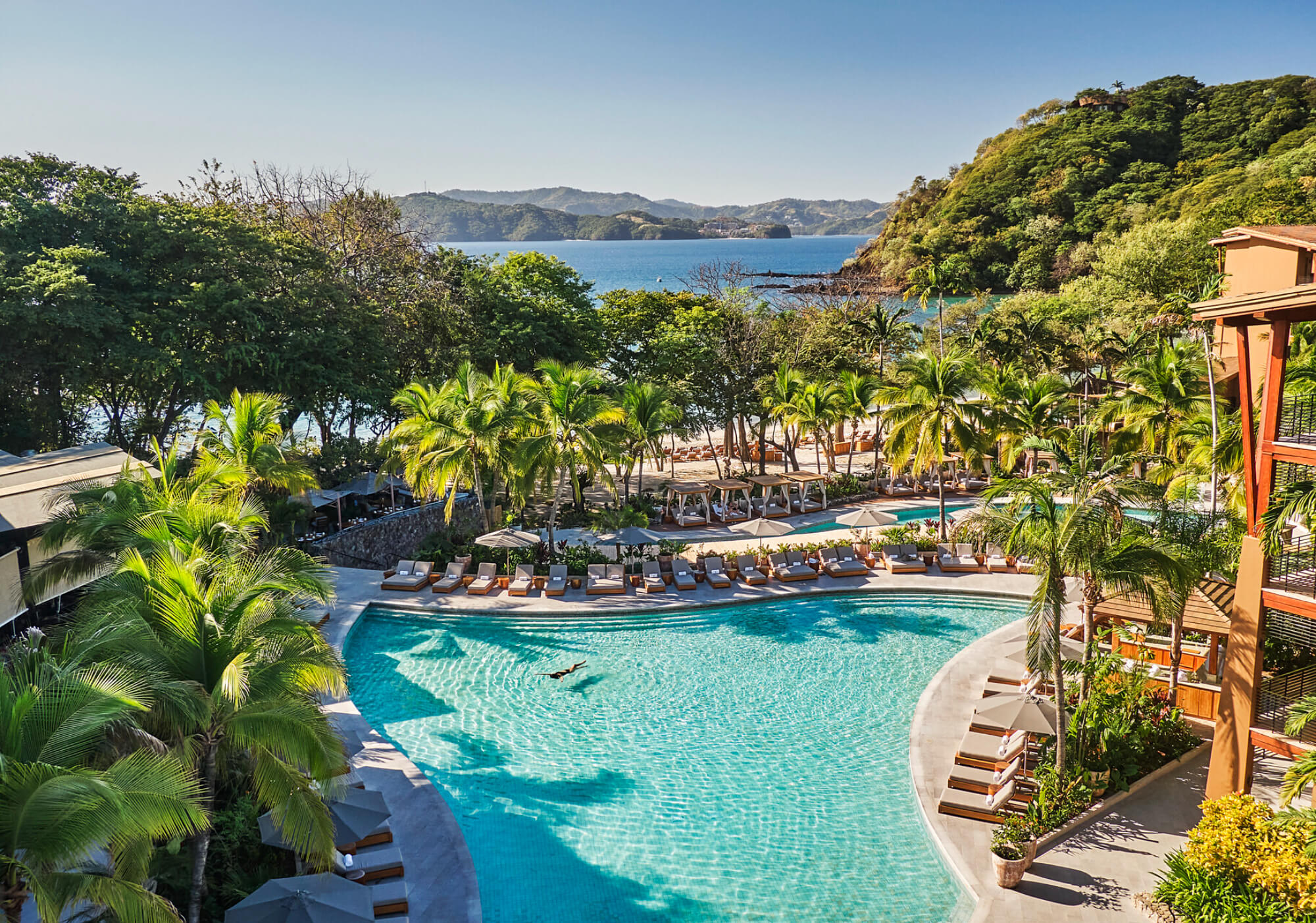 Four Seasons Costa Rica at Peninsula Papagayo pool and beach, luxury family resort in Guanacaste