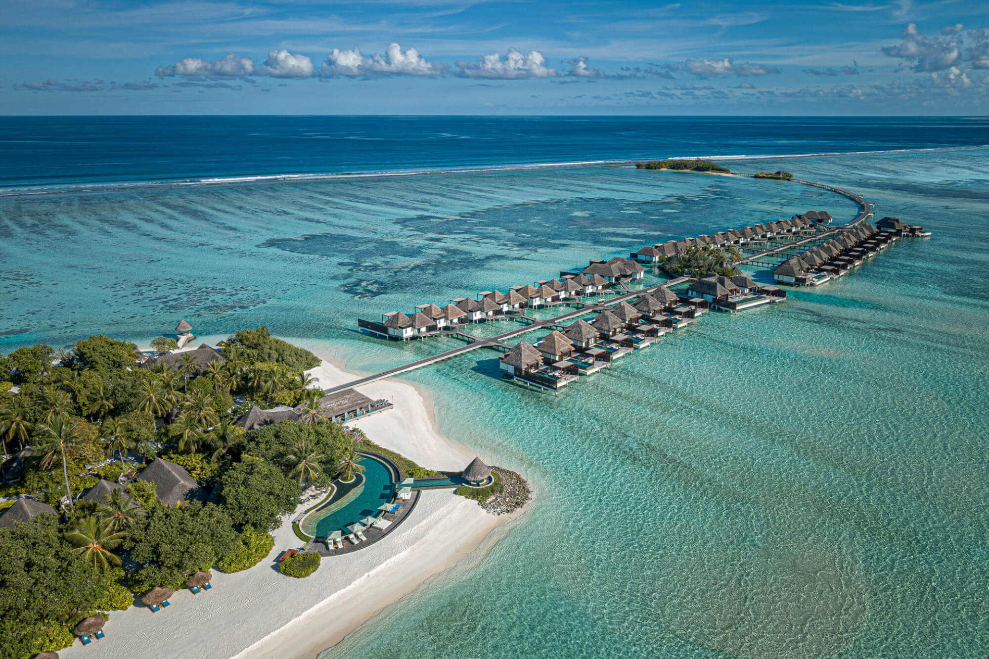 Four Seasons Maldives at Kuda Huraa overwater villa and turquoise lagoon, luxury family resort in the Maldives